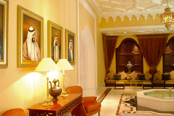 Portraits of Sheiks in the lobby of the Ritz Carlton