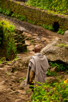 Old nomadic dudes crossing ancient bridged